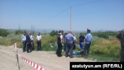 Investigators work at the site where Russian serviceman Ivan Novikov was killed in Gyumri, on June 15. 