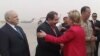 U.S. Secretary of State Hillary Clinton is greeted by Iraqi Foreign Minister Hoshyar Zebari on her arrival in Baghdad on April 25. (low quality image)