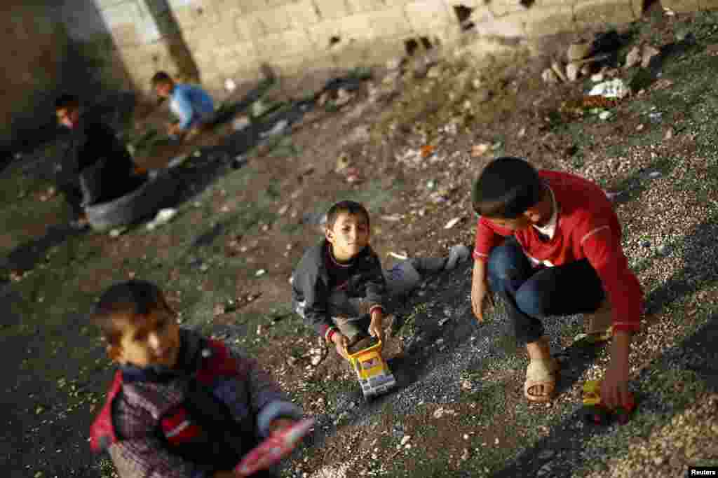 Kurdish refugee children from the Syrian town of Kobani play in a camp in the southeastern town of Suruc, Sanliurfa Province, Turkey. (Reuters/Kai Pfaffenbach)