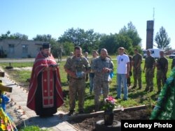 Освячення хреста на місці загибелі українських військових