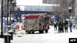 Firefighters take position after two explosions occurred near the finish line of the 117th Boston Marathon on April 15.