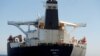 An Iranian flag flies on Iranian oil tanker Adrian Darya 1, previously named Grace 1, as it sits anchored after the Supreme Court of the British territory lifted its detention order, in the Strait of Gibraltar, Spain, August 18, 2019