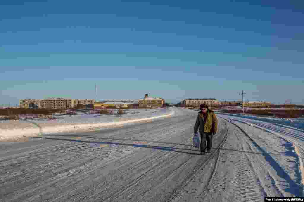 Andrei walks on the outskirts of the former mining settlement.