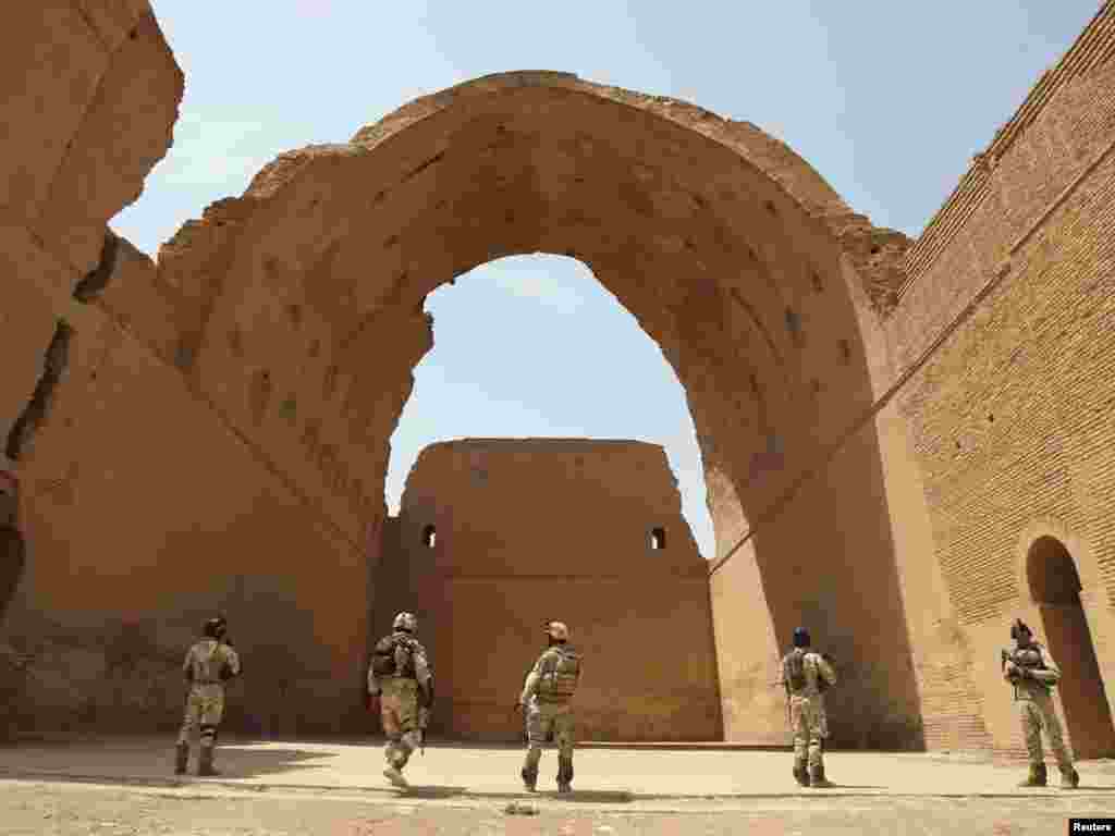 Iraqi soldiers provide security near the ancient Arch of Ctesiphon during a search operation in Salman Pak, about 30 kilometers outside Baghdad. Photo by Saad Shalash for Reuters.