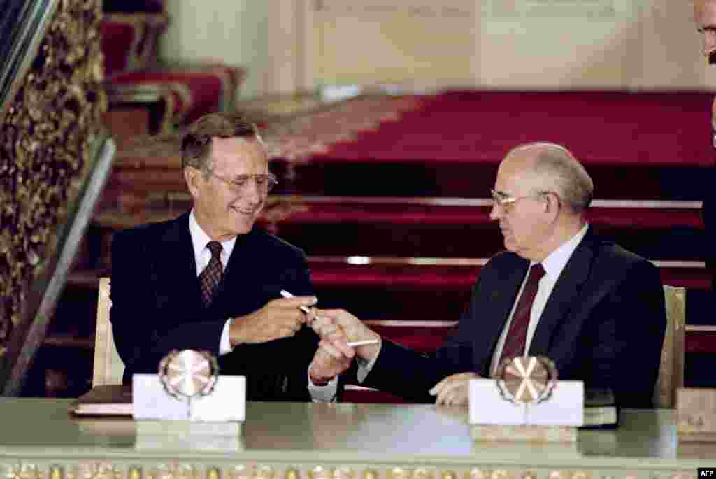 U.S. President George Bush and Gorbachev exchange pens after signing the historic Strategic Arms Reduction Treaty (START), which cut the superpowers' nuclear arsenals by up to one-third, in Moscow on July 31, 1991. 