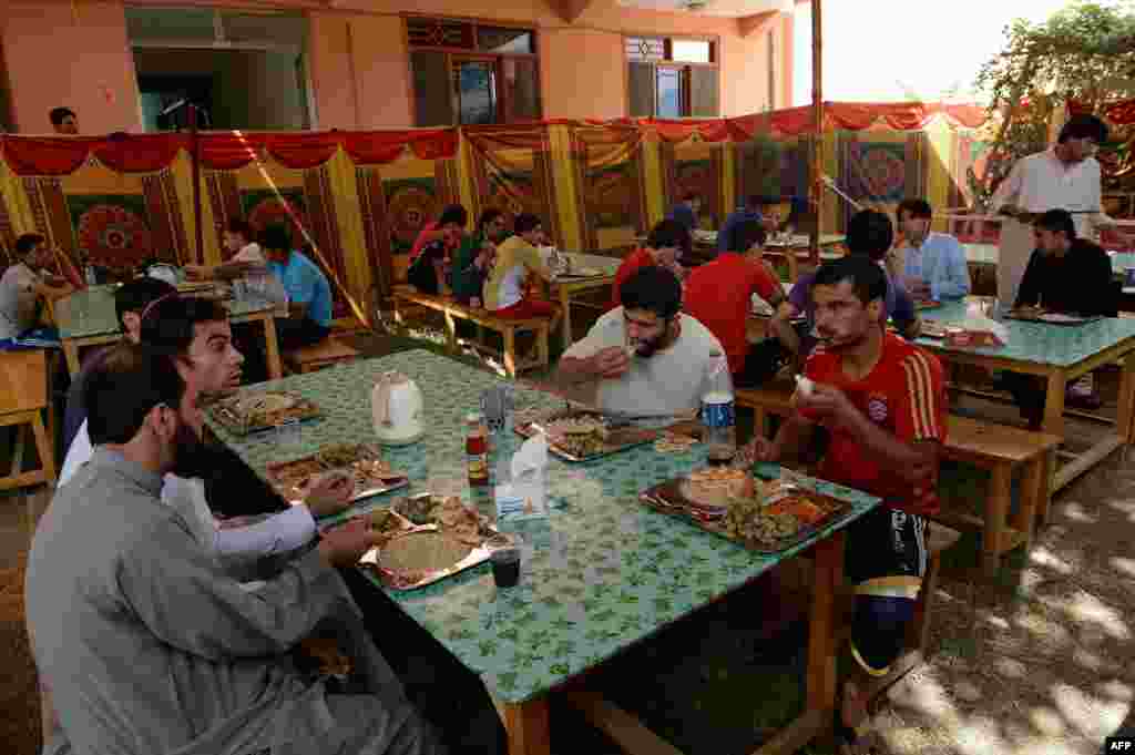 The Afghan soccer players eating lunch at their communal house in Kabul on September 2.