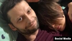 Российский врач-онколог Андрей Павленко с членами своей семьи.