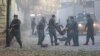 Afghan police carry away a victim after a blast in a diplomatic zone of Kabul on October 31.