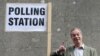 UKIP leader Nigel Farage exits a polling station following his vote for the European elections in Orpington on May 22.