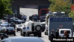 Armenia -- Armenian police officers with armored vehicles block a street leading to a seized police station in the district of Erebuni in Yerevan, Armenia, 17 July 2016. 