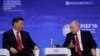 Rusiya Prezidenti Vladimir Putin (sağda) çinli həmkarı Xi Jinping ilə, arxiv fotosu