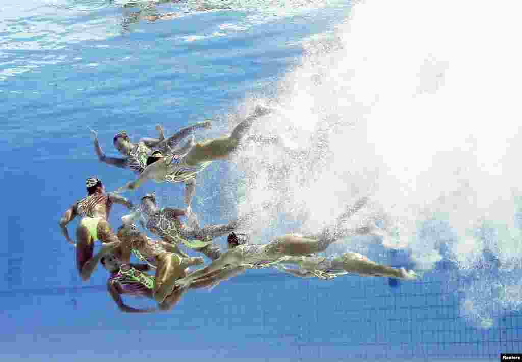 Team Japan compete during the synchronised swimming technical routine final.