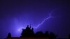 Lightning cuts through the clouds during a heavy thunderstorm in Prague on June 22. (RFE/RL/Amos Chapple)