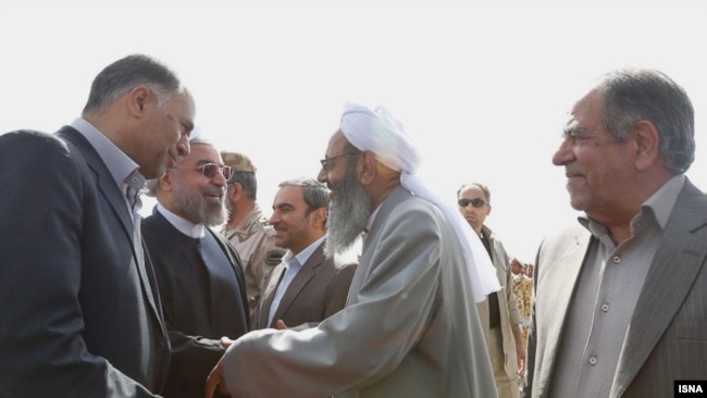 Iranian president Hassan Rohani visiting Sisatan and Baluchistan Province in south east of Iran. Sunni religious leader Molavi Abdol-Hamid, greeting the president at airport, 15 April 2014.