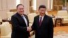 U.S. Secretary of State Mike Pompeo (L) meets wwith Chinese President Xi Jinping at the Great Hall of the People in Beijing, June 14, 2018