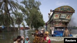 Pakistan -- the floods have created extreme conditions for Radio Mashaal's reporters to deal with. 