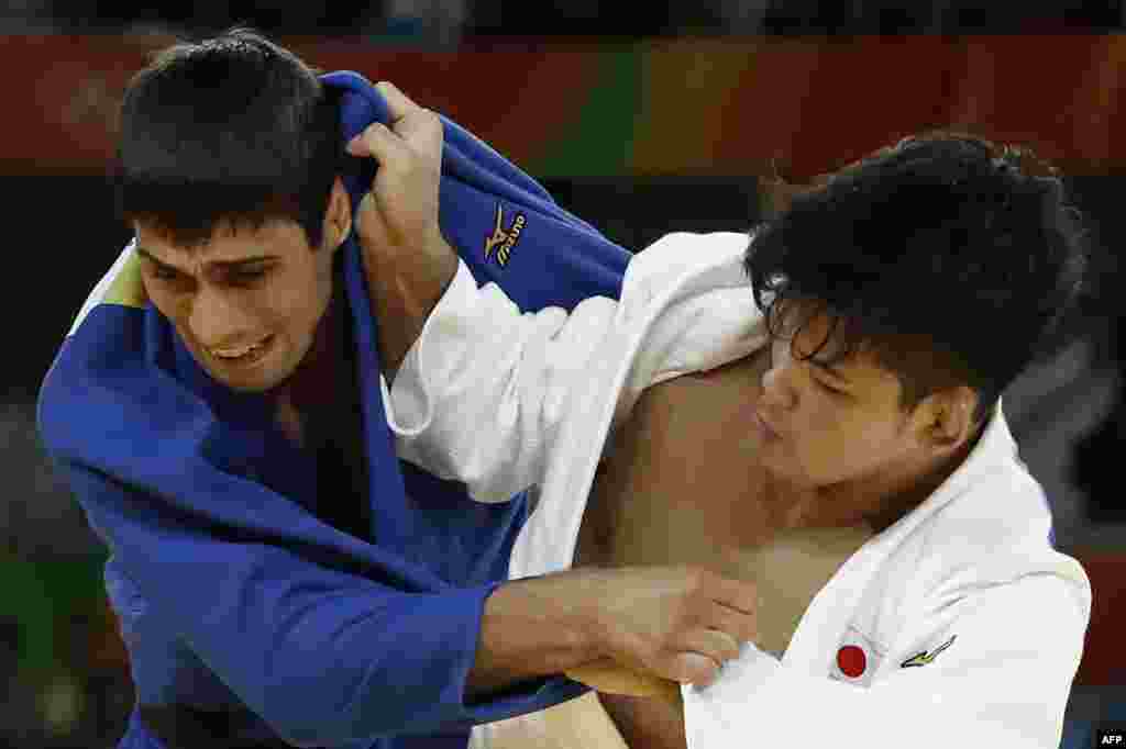 Japan's Shohei Ono (in white) won gold in the men's 73-kilogram judo division by beating Azerbaijan's Rustam Orujov.