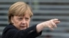 Merkel To Putin: Give NGOs 'Good Chance'
