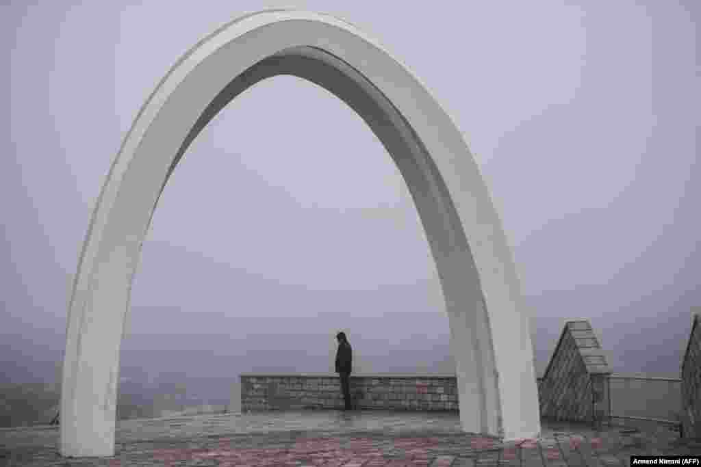 A Kosovar Albanian man stands at the memorial dedicated to the victims of the Racak massacre. In 1999, 45 Albanian civilians were killed by Serb forces in the village of Racak. The massacre, one of the bloodiest that occurred in the Kosovo crisis, led to a NATO-led air campaign that ousted Serbian security forces from Kosovo. (AFP/Armend Nimani)