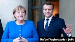 Немис канцлери Ангела Меркел менен француз президенти Эммануэл Макрон. 