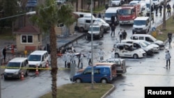 Police forensic experts examine the scene after an explosion outside a courthouse in Izmir, Turkey, on January 5.