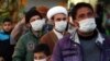 Residents of Qom, the epicenter of coronavirus outbreak in Iran, waiting to be examined by a mobile medical team. February 27, 2020. 