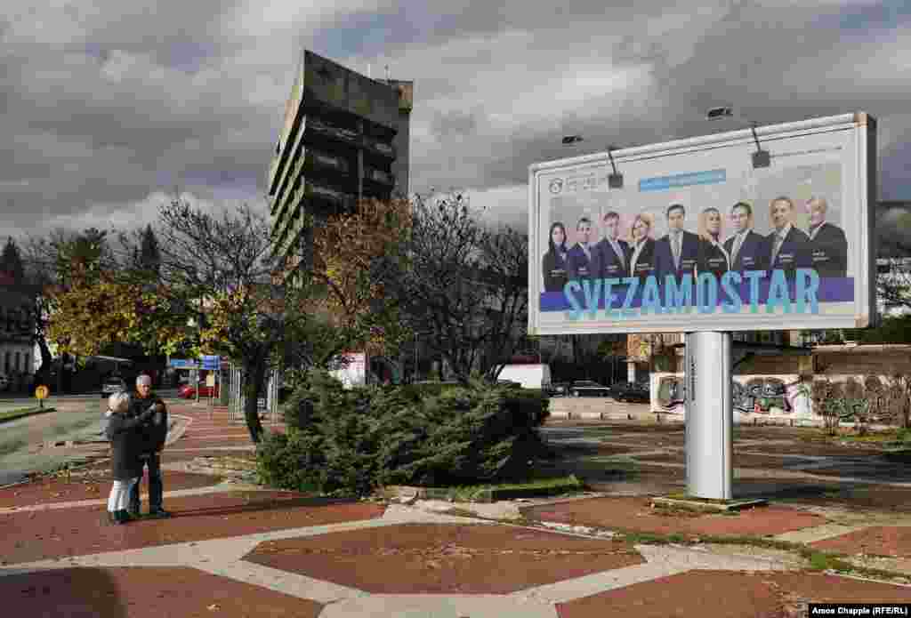 An elderly couple stop to discuss a political poster in central Mostar. The breakdown of democracy -- largely due to Bosnia’s complex postwar governing system, a ruling from Bosnia’s Constitutional Court, and political impasse between Bosnian-Croat and Bosniak parties -- has left Mostar’s mayor holding onto the office as “interim mayor” long after his original mandate expired in 2012.