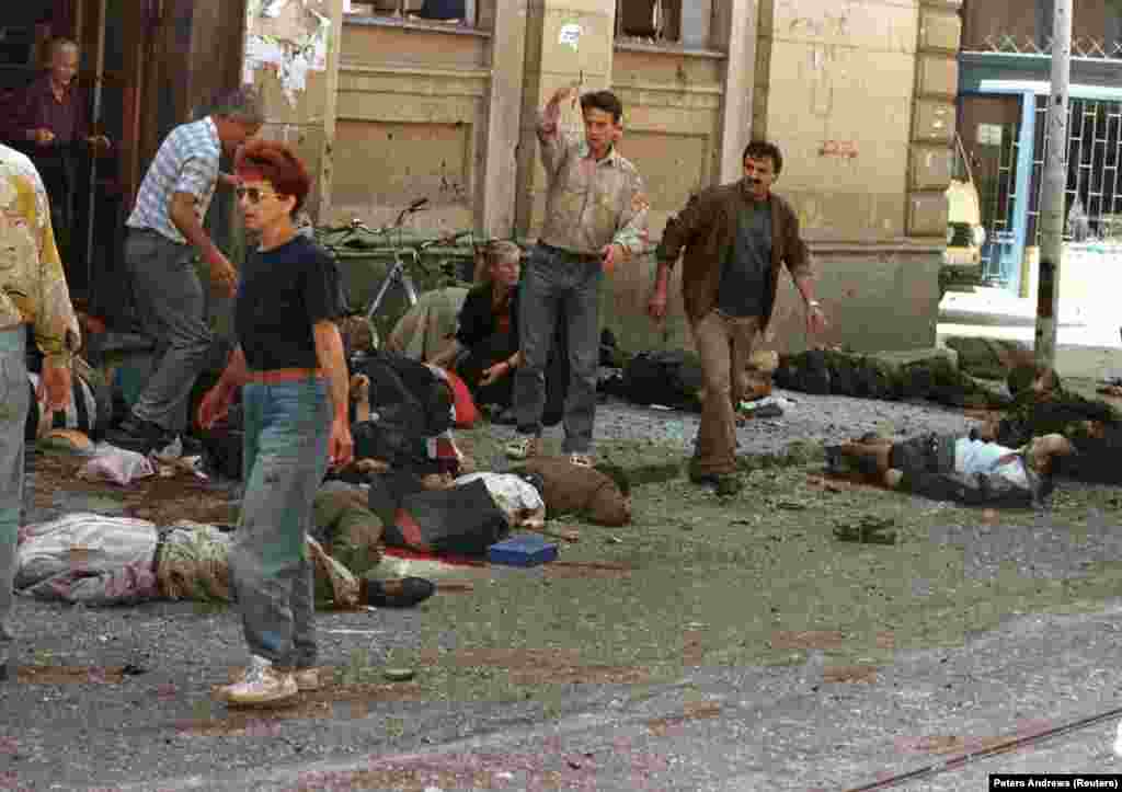 The scene after mortars slammed into the crowded Markale marketplace in central Sarajevo on August 28, 1995. Forty-three people died in this, the second of two deliberate attacks on the market that came to be known as the Markale Massacres. The August shelling was among the reasons cited for NATO&#39;s bombing of Bosnian Serb forces, which started later the same month.