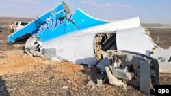 Debris from the ill-fated Metrojet Airbus lies strewn across the sand at the crash site on the Sinai Peninsula. 