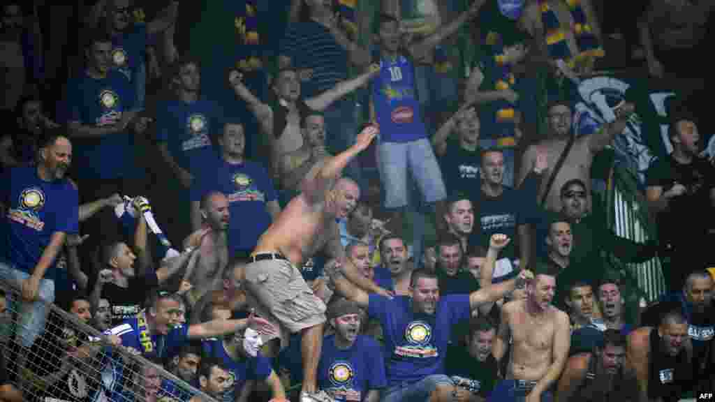 Bosnian fans cheer during a EuroBasket 2013 match between Bosnia and Serbia held in Jesenice, Slovenia. (AFP/Samuel Kubani)