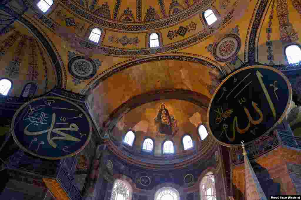 The same location photographed on July 2, showing the now obscured Christian fresco. 