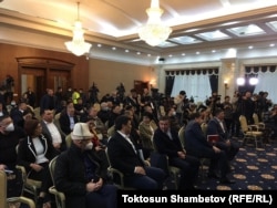 Kyrgyz lawmakers gather outside of Bishkek on October 10.