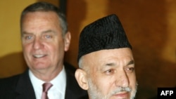 U.S. National Security Adviser James Jones (left) and Afghan President Hamid Karzai in Munich