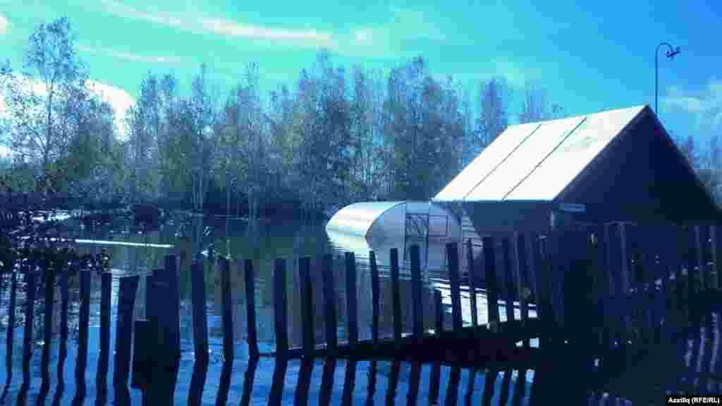 Another home is unreachable because of the high flood waters.