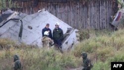 Investigators at the crash scene in Perm
