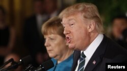 U.S. President Donald Trump and German Chancellor Angela Merkel at the White House last month