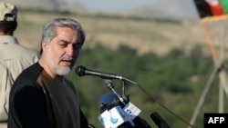 Afghan presidential candidate Abdullah Abdullah addresses supporters during an election campaign rally in the Paghman district of Kabul Province on June 9.