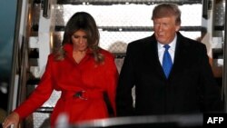 Donald Trump (sağda) və birinci ledi Melania Trump