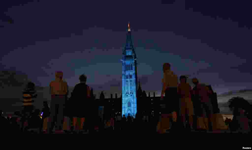 The Peace Tower on Parliament Hill in Ottawa is lit-up in blue to celebrate the birth of a baby boy to Britain's Prince William and Catherine. The British monarch is officially the head of state of Canada. 