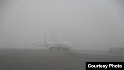Tajikistan -- Dushanbe, plane, fog, airport, 