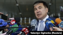 Mikheil Saakashvili speaks with journalists after meeting with members of Ukraine's Servant of the People parliament fraction in Kyiv on April 24.