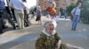 An old woman cries as Belarusian riot police detain opposition activists during a rally in Minsk on July 27 to mark the 20th anniversary of Belarus's declaration of sovereignty. <br /><br />Photo by Victor Drachev for AFP