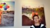 Russian-born photographer Alexander Kargaltsev stands in front of one of his portraits, of a gay couple posing in Central Park, at his exhibition launch on October 26.