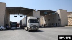 International humanitarian aid trucks cross into Syria at the Bab al-Hawa border crossing in 2020.