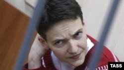 Savchenko sits inside a defendants' cage as she attends a court hearing in Moscow on March 4.