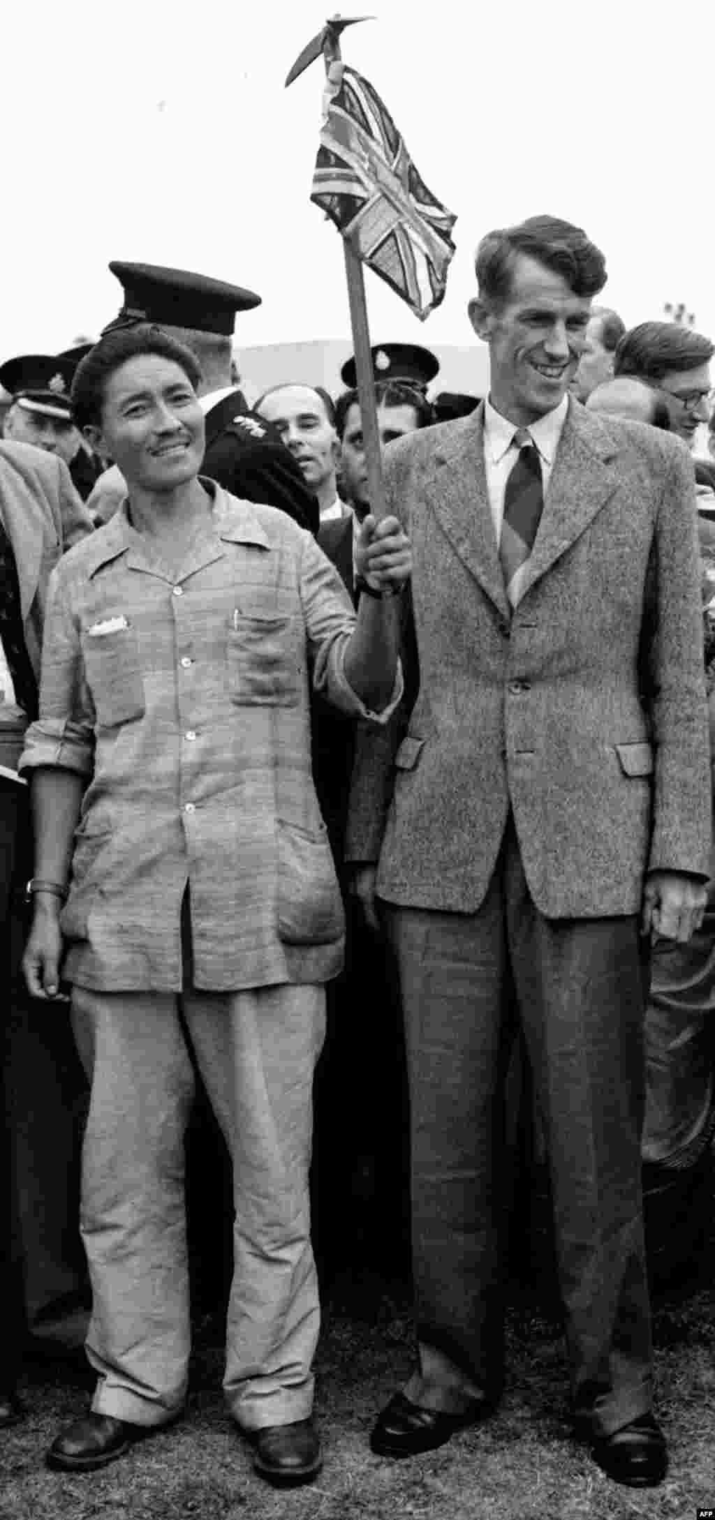 A photo from July 3, 1953, shows pioneering Mount Everest climbers Edmund Hillary of New Zealand and Tenzing Norgay of Nepal in London after their expedition.