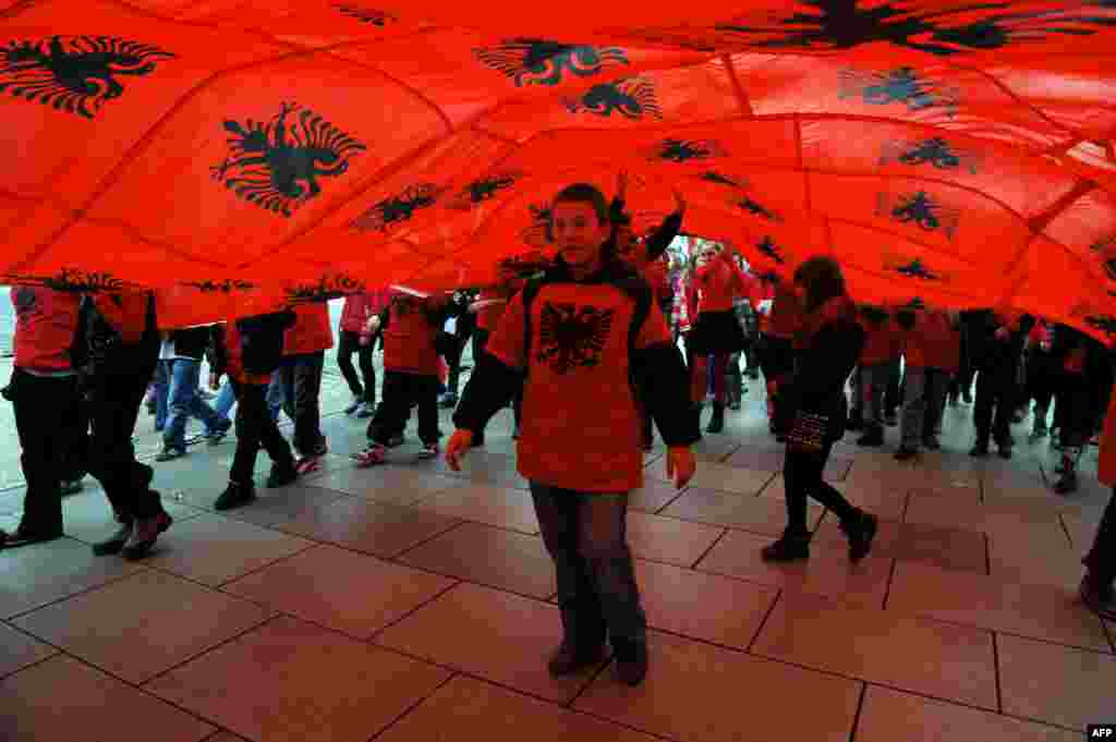 Ethnic Albanian children march under Albanian flags in Pristina, Kosovo, during celebrations of the 100th anniversary of Albania&#39;s declaration of independence on November 28. (AFP/Armend Nimani)