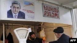 A butcher shop in Yerevan, under the watchful gaze of President Serzh Sarkisian.