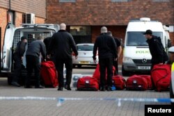 Investigators examine the site in Salisbury where Sergei Skripal and his daughter were found unconscious on March 4. (file photo)