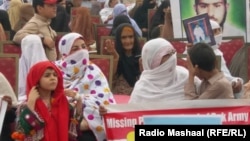 Thousands of women, children, and men held up photos, placards, or the natoinal ID cards of their missing family members.